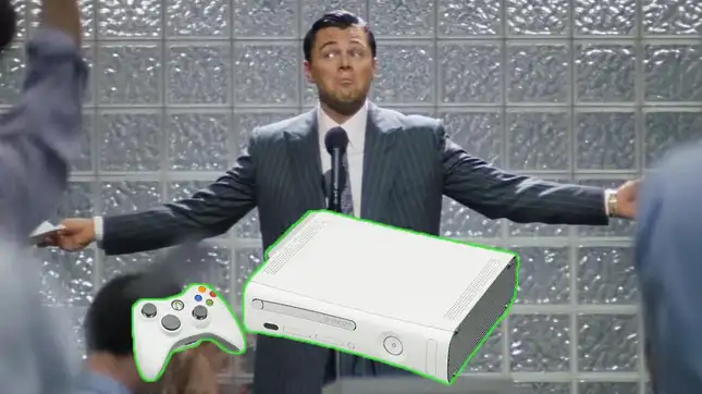 Leonardo DiCaprio stands behind an Xbox 360. 
