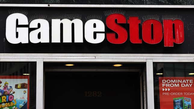 A GameStop sign hangs on a building. 